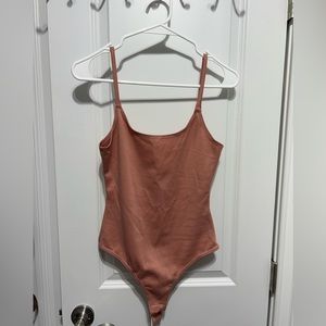 Priceless mauve bodysuit, new, small